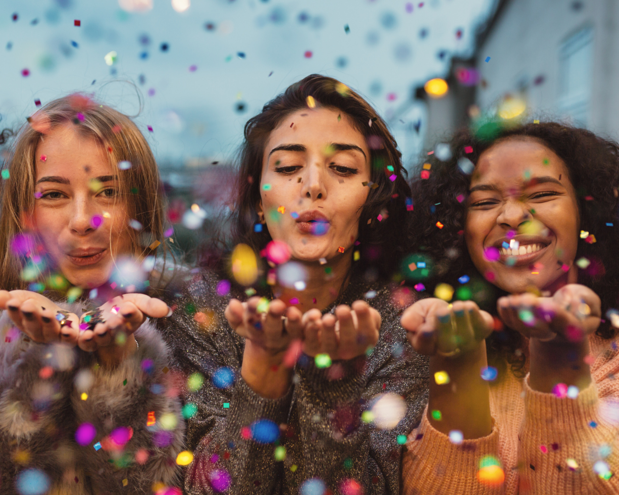women celebrating compensation change